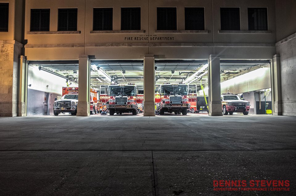Various emergency vehicles lined up in the station, ready to be deployed.