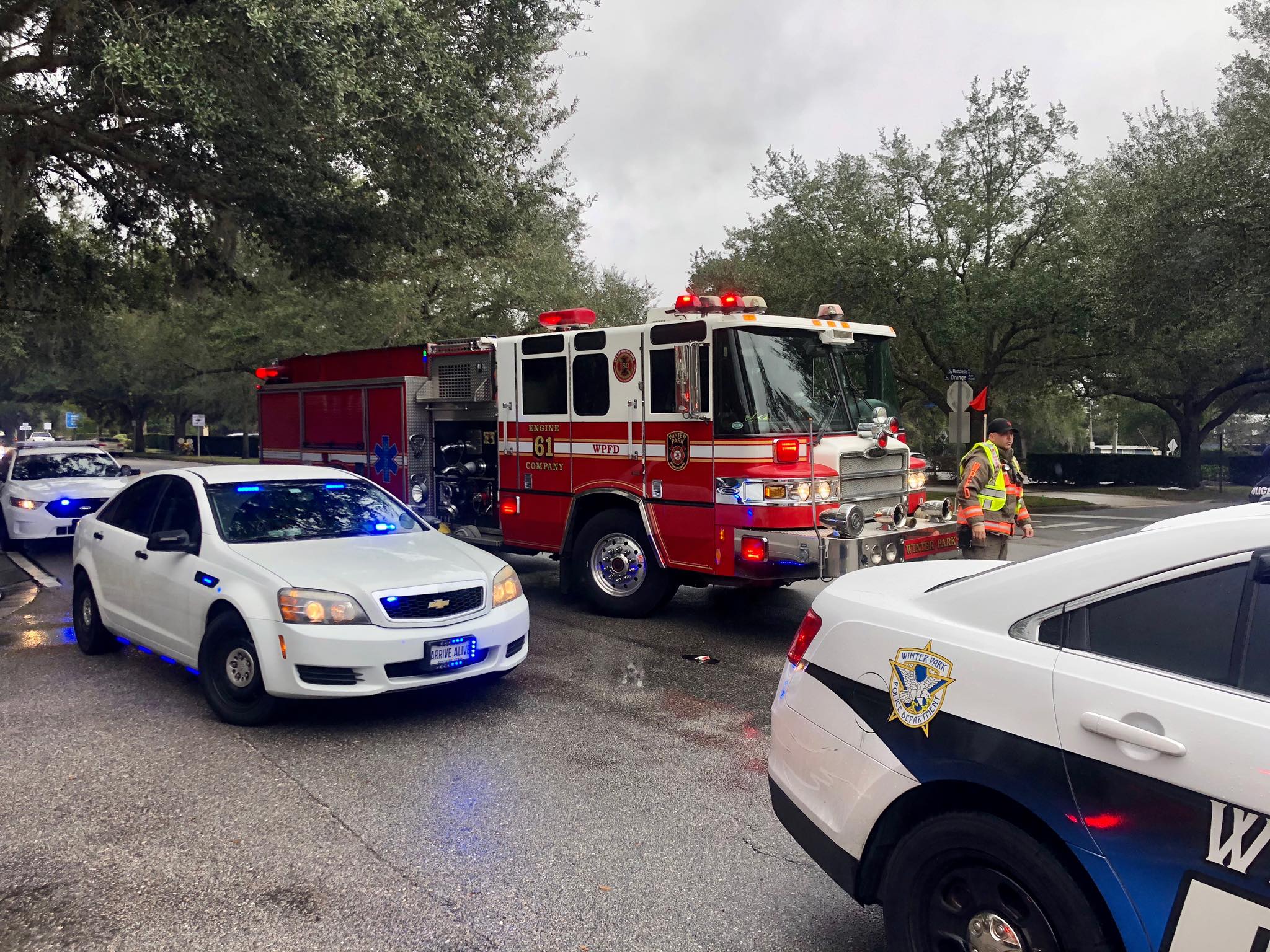 Firetruck and police cars respond to a car accident.