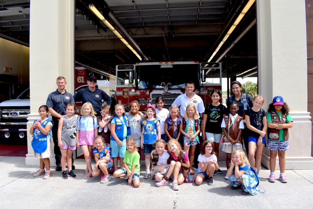 Group of kids with firefighters.